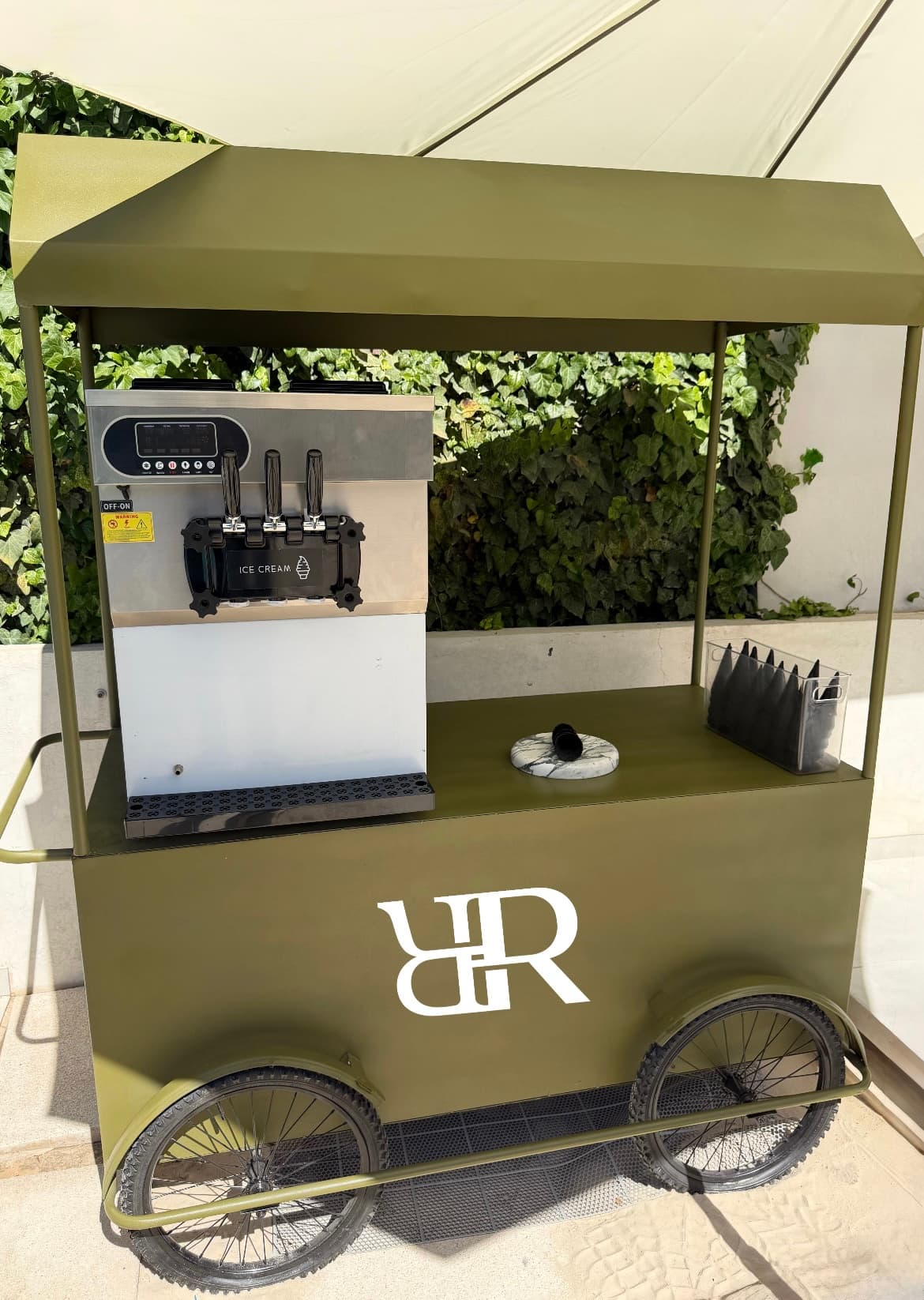 Refyned soft serve cart with olive green frame and ice cream machine